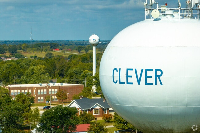 Another one of the Clever water tower shows its prominence above trees and rooftops.