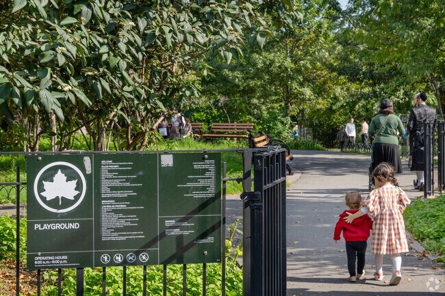 The large playground complex at Gravesend Park draws children of all ages for playtime.