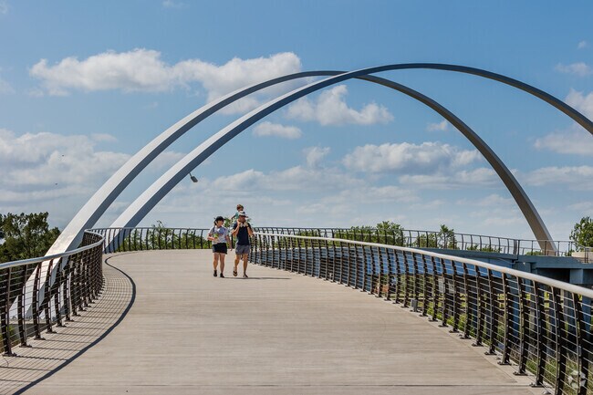 Families love walking the Noisette Creek Pedestrian Bridge to enjoy Riverfront Park.