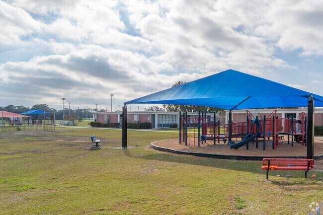 Lanier Elementary School has a playground in the backyard.
