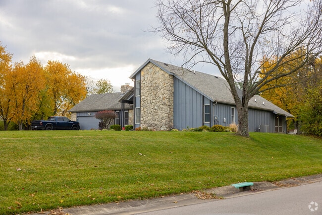 Stone and cedar contemporary family homes are available in Madison neighborhood.