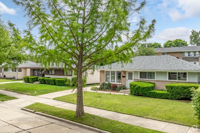 Rows of ranch-style homes can be found on streets with large trees in River Bluff.