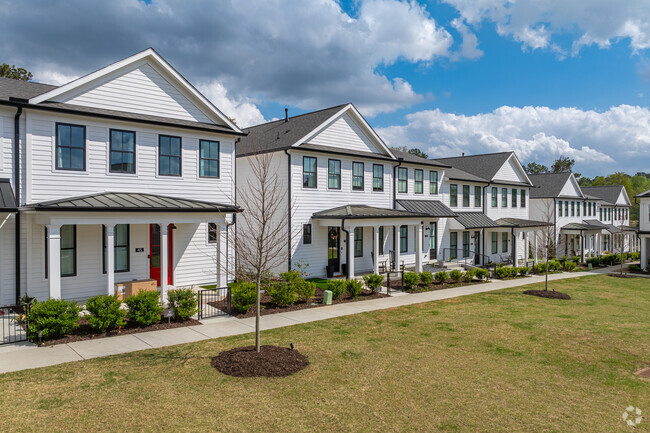 Lush rows of stunning, newly constructed homes adorned with vibrant gardens and colorful flowers gracefully line the picturesque streets of Auburn, inviting families to settle into their charming embrace.