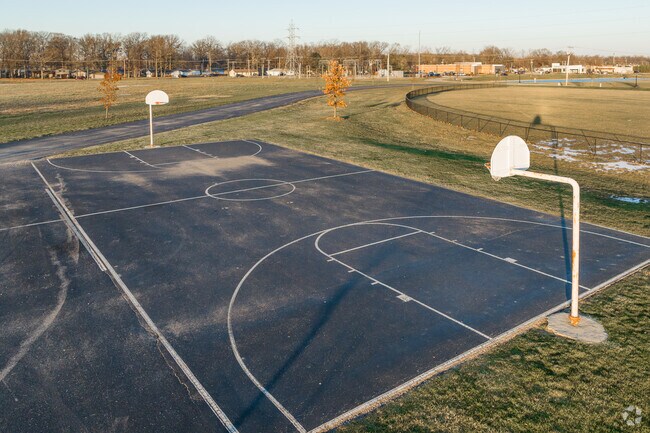 Shoot hoops on the basketball court at Praise Park in Fort Wayne.