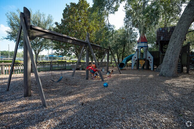 Magic Forest Playground, aka Rainbow Park offers a variety of swing options throughout.