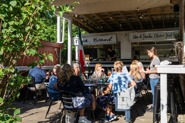 Enjoy the patio while sampling wine at the Yosteria Wine Bar near McGuffey Heights.
