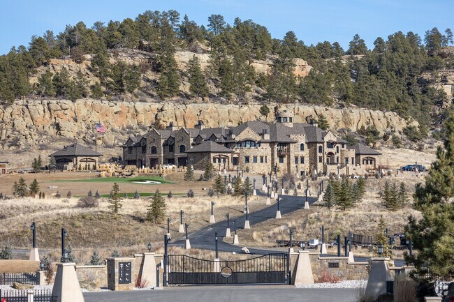 A hillside castle inspired mansion in West Shiloh with scenic views and unique architecture.