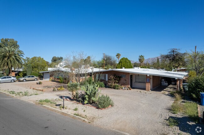 Midcentury modern homes standout in Mitman with circular driveways.
