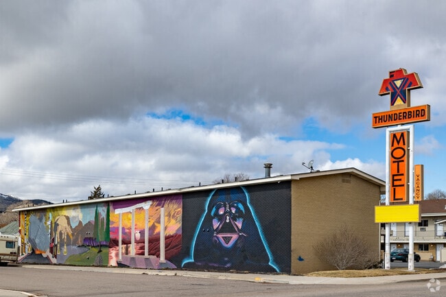 Classic mid century architecture paired with colorful murals will bring joy to your day and a smile to your face.