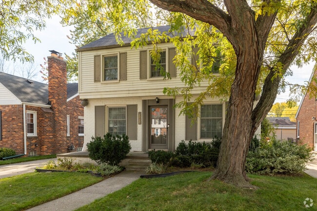 Quaint colonial homes sit on tree-lined streets in Grosse Pointe Woods.