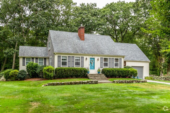 Touisset neighborhood in Massachusetts features Cape Cod style homes with modern additions.