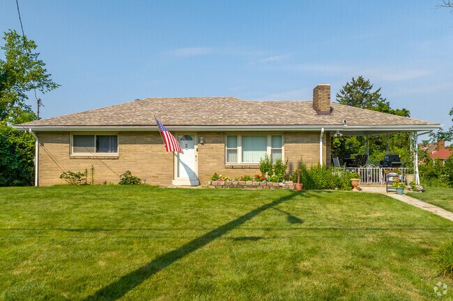 Rancher style architecture in Summer Hill often feature covered porches to escape the summer hea
