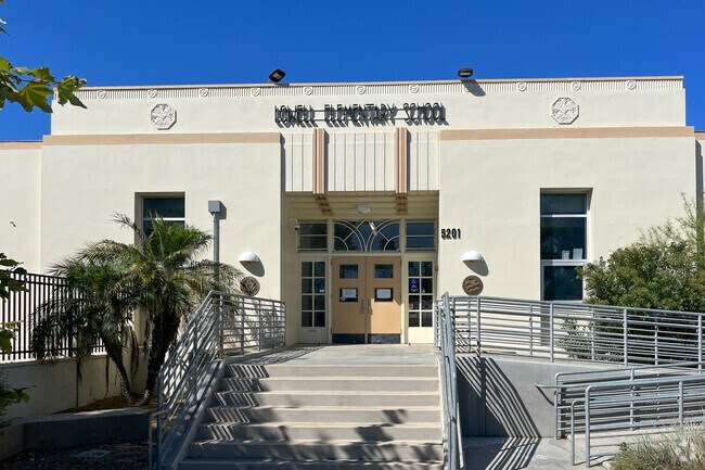 Students at Lowell Elementary School enter through the Art Deco in the front of the school.