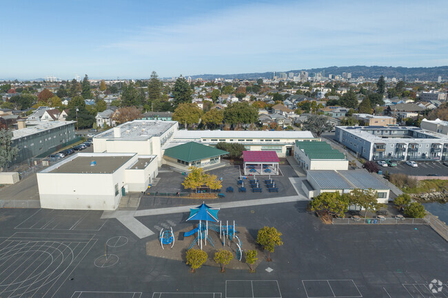 The back play area at Paden Elementary School in Alameda is cement but new with water views.