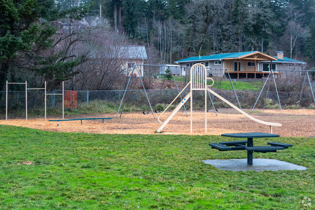 Stevenson Elementary School playground features swings and several play structures.