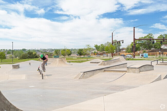 Kids and adults enjoy the skatepark at Carpenter Park in Thornton, Colorado.