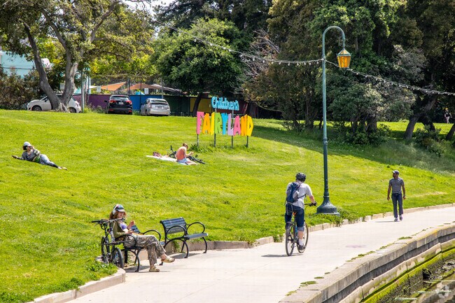 Nearby Lakeshore at Fairyland people enjoy the beautiful green areas to relax.