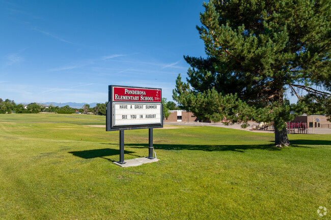 Ponderosa Elementary School
 sign at the street corner in Village East.