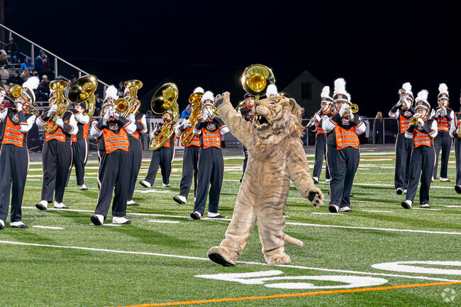 The Washington High mascot puts on a show with the marching band for East Brookfield residents.