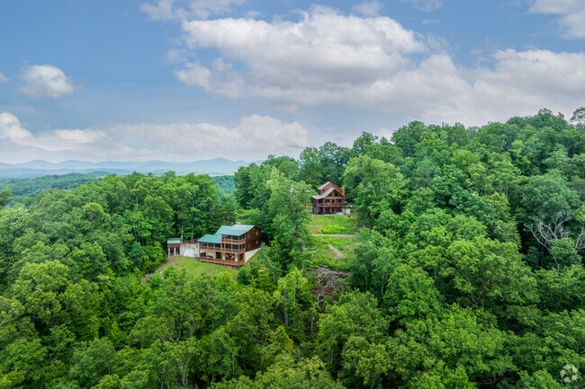 Live atop a breathtaking mountain in Blue Ridge, where every sunrise paints the sky with vibrant colors.