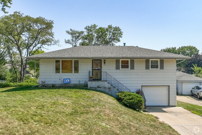 Ranch homes with basement garages offer multi-level living spaces in One By One.
