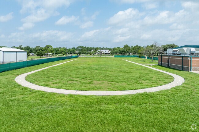 Rustic Oak Elementary features a track and a large sports field space.
