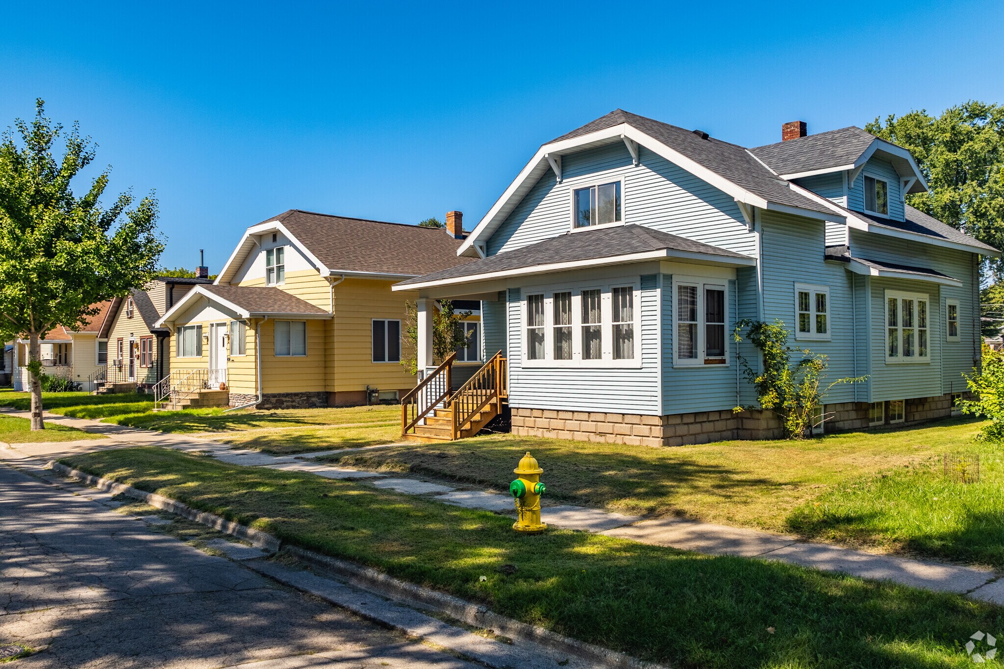 There are several brightly colored homes lining the quiet streets of three Corners.