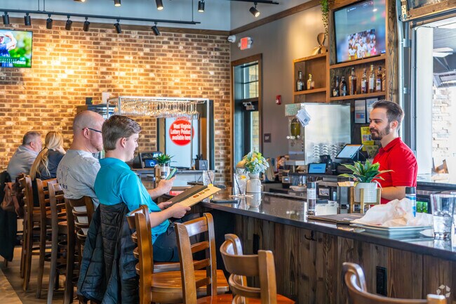 River Town Prime Steakhouse & Grill invites residents to enjoy unwind at the bar.