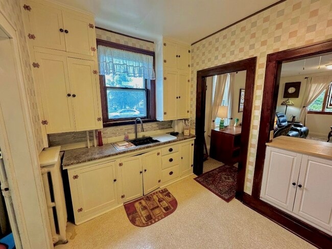 Bright kitchen with pass through to living room