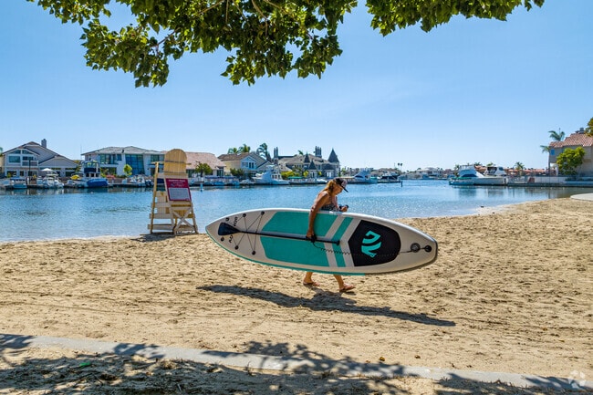 Take your paddle board out to the calm waters in Huntington Harbor.