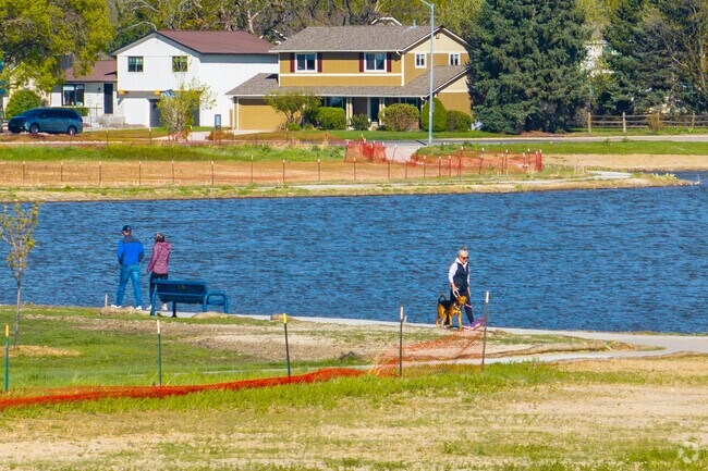 Walk your dog along the gravel trail at Lake Arbor Park in Arvada.