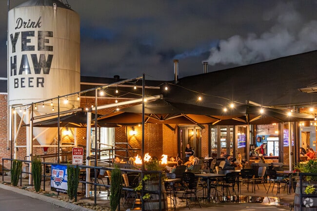 Yeehaw Brewing Company features a large fire pit on the patio perfect for a relaxing evening.