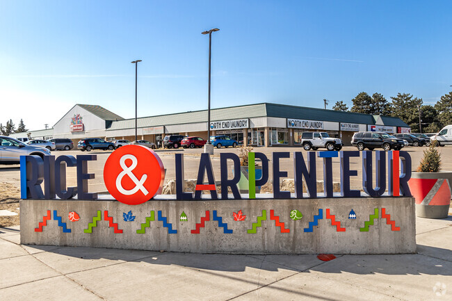 Colorful signage adorns the major shopping area at Rice and Larpenteur  in Western Hills.