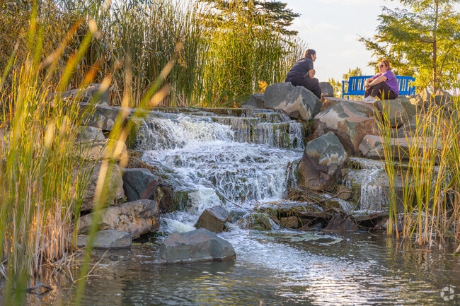 Rendezvous Park offers the luxury of a calming waterfall surrounded by tall grass and cool shade