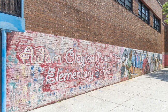 PS 153 Adam Clayton Powell school has some amazing artwork displayed on its outer walls.