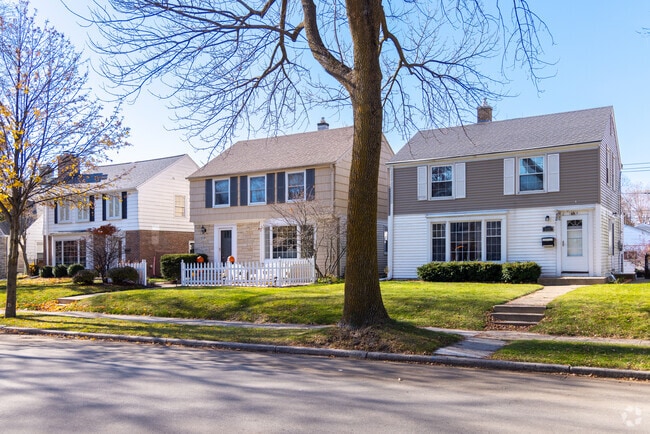Sidewalk-lined streets in Parkway feature neatly arranged homes and mature trees.