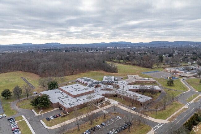 The student-teacher ratio at John Wallace Middle School is 13:1.