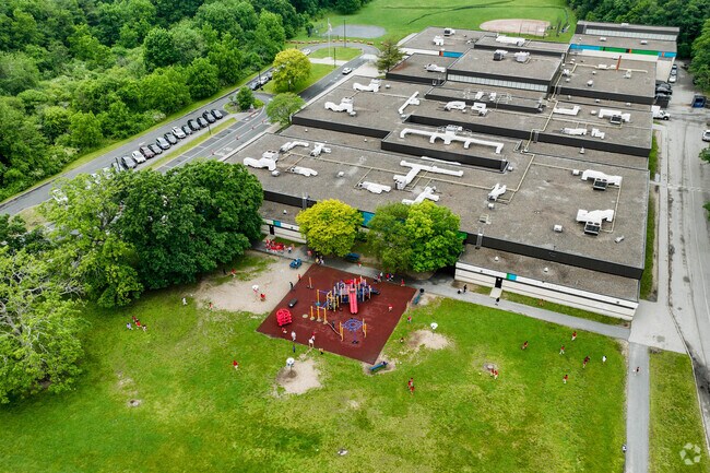 A vast play structure sits just in front of Raymond Elementary School in Brockton.