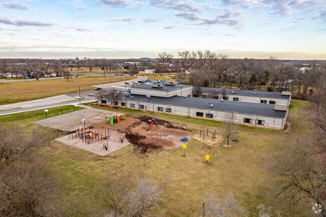 Rawsonville Elementary has a large play area behind the school with multiple play structures.