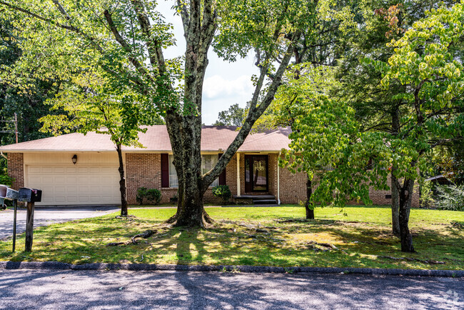 The brick ranch style home with attached garage in the Falling Waters neighborhood.
