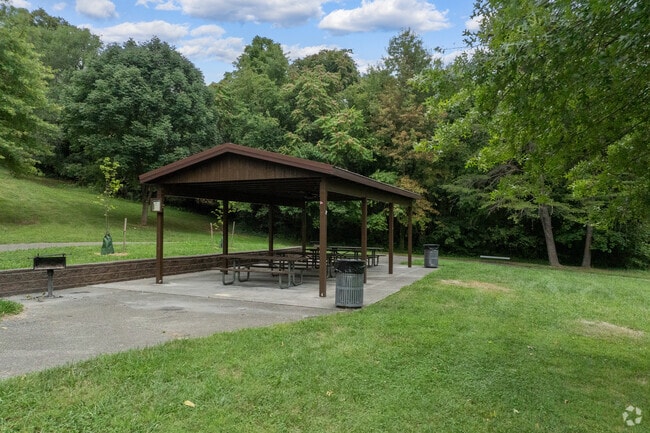 Picnic areas with tables invite families for gatherings, barbecues, and community events.
