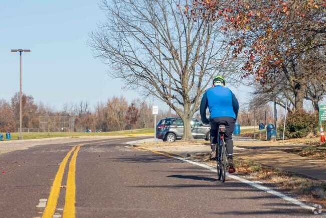 Resident goes for a bike ride in the Uplands Park neighborhood.