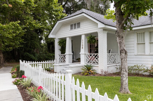 Traditional white picket fencing and lush landscaping in Avondale.