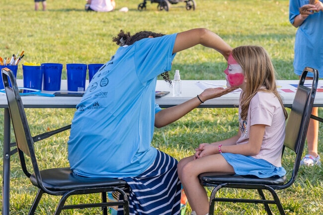 Kids enjoy face painting at East Pete Days festivities.