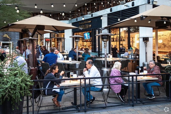 Tommy Bahama Marlin Bar serves island‑inspired plates near Four Seasons.