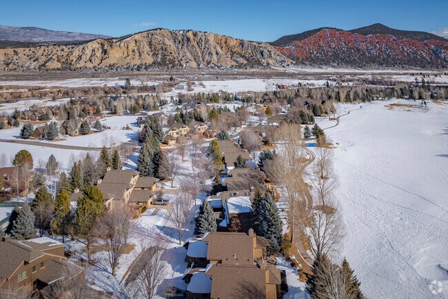 Discover the charm of Aspen Glen, where elegant homes and cozy townhomes blend perfectly with nature's beauty in a secure gated community.