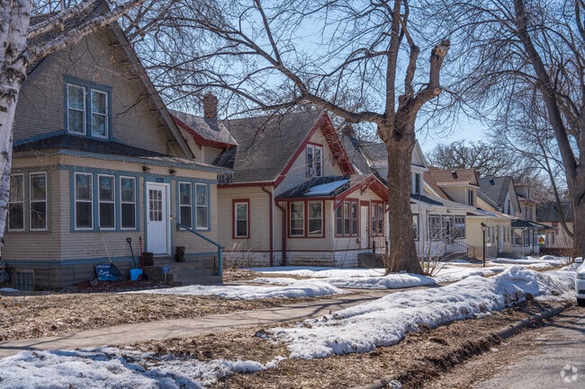 Rows of two-story bungalow houses with enclosed porches.