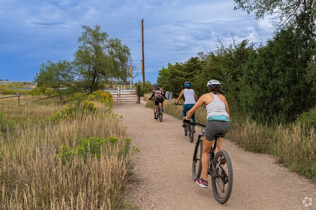 A group of friends from Mulberry Hill enjoys mountain biking on a nearby trail.