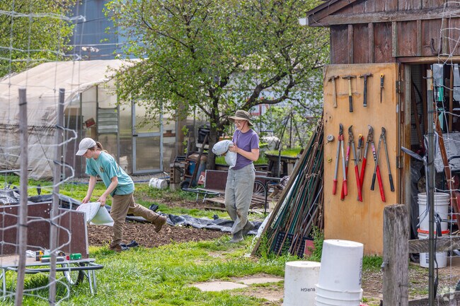 Volunteers at Braddock Farms prepare the fields for gardening.