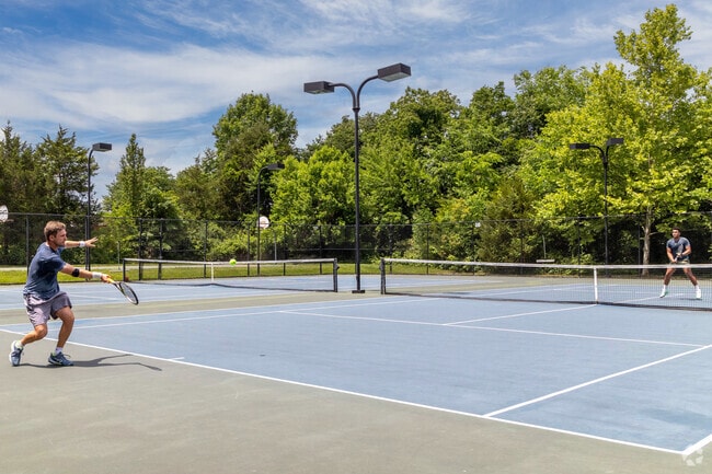 Play a friendly game of tennis at Hillside Park in Broadlands.